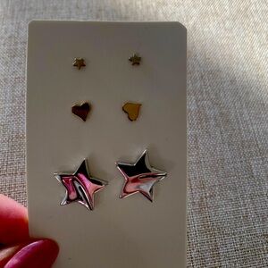 Three pairs of earrings, never worn.